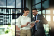 © K Seisa/peopleimages.com - Impressive. Shot of two businesspeople looking over a tablet in the office.