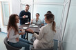 © New Africa - Team of employees enjoying coffee break together in office. Startup project