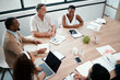 © Micah C/peopleimages.com - Its always good to catch up with my team. Shot of a group of businesspeople having a meeting at work.