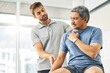© Tamani Chithambo/peopleimages.com - Are you in pain at the moment. Cropped shot of a young male physiotherapist assisting a senior patient in recovery.