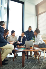 Fototapete - Everyone is on deck for this meeting. Shot of a group of businesspeople discussing work during a boardroom meeting.
