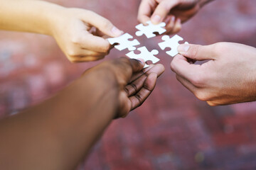 Poster - Finding solutions piece by piece. Shot of hands putting puzzle pieces together.