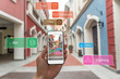 © hakule - Augmented reality marketing street . Hand holding smart phone use AR application to check information
