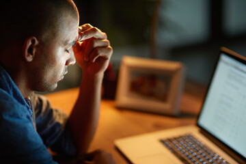 Aufkleber - The long hours are getting to him. Cropped shot of a young businessman looking stressed out while working late in an office.