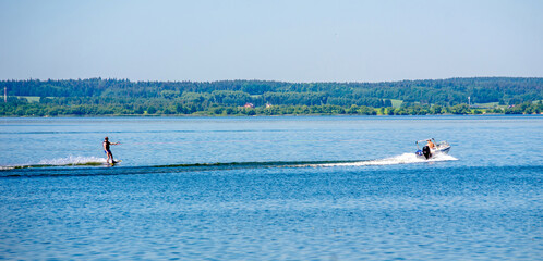 A man water skiing on a lake
