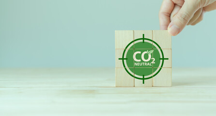 Canvas Print - Carbon neutral sustainable development concept. Green industry. Net zero greenhouse gas emissions target 2050. Climate neutral long term strategy. Wooden cube with carbon neutral, save the world icon