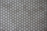 Fototapeta  - Grey honey hexagonal cells of seamless texture. The texture of the mesh with honey and geometric hexagonal honeycombs of the hive. Vector illustration.