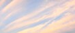 Clear blue sky with glowing pink cirrus and cumulus clouds after storm at sunset. Dramatic cloudscape. Concept art, meteorology, heaven, hope, peace, graphic resources, picturesque panoramic scenery