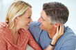 © Arcurs Co-op/peopleimages.com - Blissful time together. Shot of a mature couple being affectionate at home.
