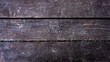 Wooden terrace board made of dark brown weathered wood. Rustic macro close up