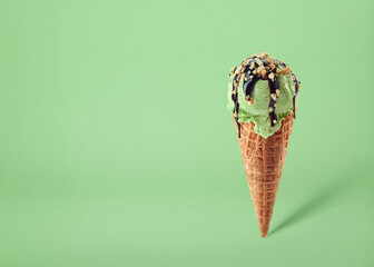 Wall Mural - Pistachio ice cream scoop in waffle cone
