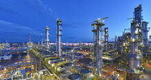 Refinery - Chemical Factory At Night With Buildings, Pipelines And Lighting - Industrial Plant