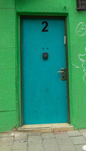 Old Blue Door And Green Wall