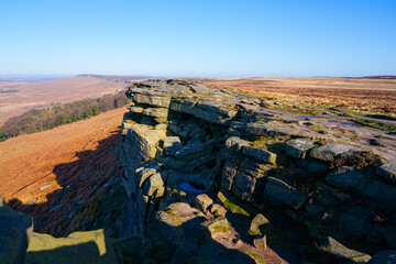 Wall Mural - Robin Hood's cave and balcony nestled on the cliff face of Stanage Edge