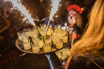 Poster - Shots with drink decorated with fireworks on a tray served by a female