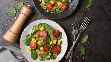 Wall Mural - Healthy salad with fresh baby spinach, cherry tomatoes, avocado and salmon fish