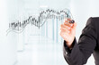 © Fabio Balbi - A woman hand drawing Business Growth Graph