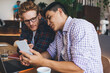 © BullRun - Multiracial business men working in office space