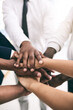 © Ruan Jordaan/peopleimages.com - Bring it in team. Shot of a motivated group of unrecognizable businesspeoples hands forming a huddle.