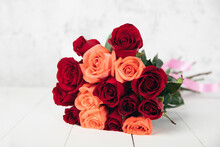 Closeup Of A Bouquet Of Red And Orange Flowers On A White Background