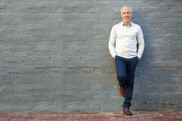 Aufkleber - Theres no pressure when youre this good. Portrait of a mature businessman standing with his hands in his pockets against a brick wall.