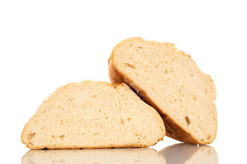 Two halves of a loaf of fresh fragrant white wheat bread, macro, isolated on a white background.