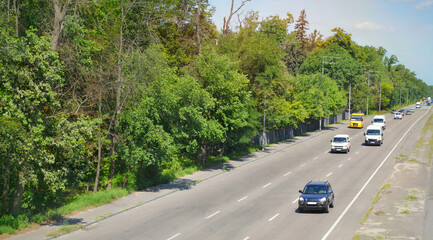 Intercity road from Irpin to Kyiv in summer time. Suburban speedway in Ukraine