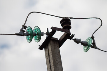 Metal electric pole against the sky.