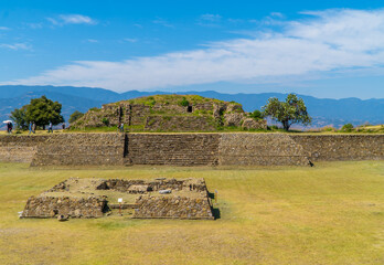 Wall Mural - Photo of tourists and temples in the Zapotec Monte Alban Archaeological Zone in Oaxaca, Mexico