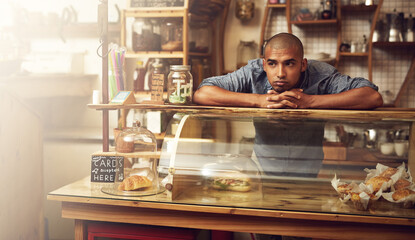 Aufkleber - Where are all the customers. Shot of a young man standing behind the counter of his store and looking downhearted.