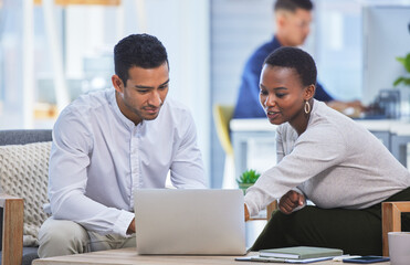 Fototapete - Id go with this one. Shot of two businesspeople discussing something on a laptop while sitting together in an office.