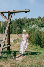 Woman Swinging On A Swing