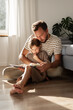 © Milles Studio/Stocksy - Dad helping kid to read book
