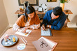 © ByLorena/Stocksy - Designers couple coworking at home