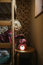 Young Girl In Her Room With A Night Light