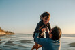 © Erin Brant/Stocksy - Father lifting daughter into the air