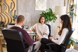 © Igor Kardasov/Stocksy - Sad couple sitting near psychologist during appointment