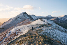 Walker In The Snow At Sunrise On Cat Bells