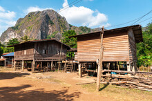 Humble House Made Of Wood In Farming Area Of Laos