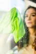 © Sasa Savicic/Stocksy - Green window cleaning cloth