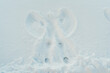 © Jessica Klaus/Stocksy - Outline of a snow angel.