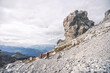 © plpictures by Paedii Luchs/Stocksy - Trail runners running through a rocky alpine landscape.