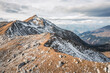 © plpictures by Paedii Luchs/Stocksy - Two runners on ridge line in the mountains.