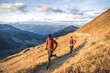 © plpictures by Paedii Luchs/Stocksy - Athletic couple running in the mountains