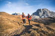© plpictures by Paedii Luchs/Stocksy - Two friends running into the mountains.