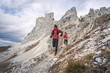 © plpictures by Paedii Luchs/Stocksy - Happy trail runners in rocky landscape