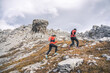 © plpictures by Paedii Luchs/Stocksy - Two trail runners in rocky terrain in the alps