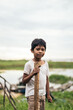 © Pedro Merino/Stocksy - Peruvian little boy in the amazon river