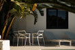 © Malquerida Studio/Stocksy - Outdoors furniture in Backyard