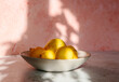 © Helen Rushbrook/Stocksy - Lemons in dappled light